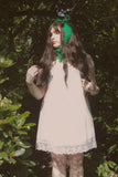 Kara wearing the Frog Headband in Emerald Green.