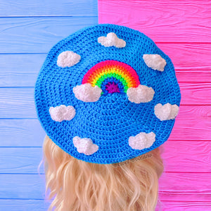 Neon Rainbow Cloud Beret - Bright blue crochet beret with white cloud and neon rainbow design by VelvetVolcano