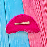 The felt backing and silver plated hair clip of the VelvetVolcano Neon Rainbow Cloud Hair Clip