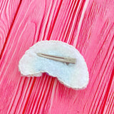 The back of a VelvetVolcano Ultra Pastel Rainbow Cloud Hair Clip, showing a white felt backing and a silver plated hair clip