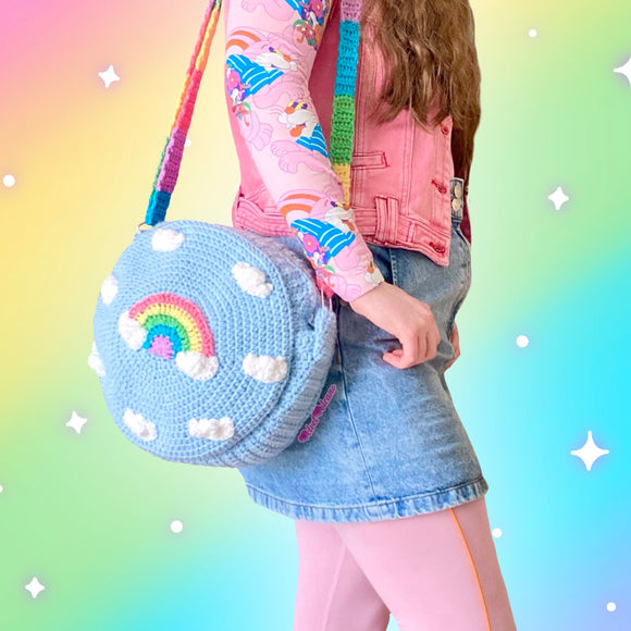 VelvetVolcano Circular Crochet Shoulder Bag in Duck Egg Blue with White Cloud and Pastel Rainbow Design and Pastel Rainbow Striped Strap