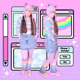 2 cut out photos of Tamsyn wearing a pastel rainbow cropped sweater with cloud pattern sleeves, lilac leggings, a light wash denim mini skirt, chunky pastel platform boots with pastel rainbow striped flared leg warmers, and a lilac fuzzy teddy bear beanie. She is also wearing a light pink face mask with white flower print. The background is an illustrated pastel vaporwave computer screen with windows, clouds, sparkles and a rainbow.