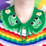 Emerald green crochet Peter Pan style collar with pastel green scallop trim on the bottom edge, cute frog appliques on the lapels of the collar and a repeating pattern of daisies and pastel strawberries on the rest of the collar. Froggy Collar by VelvetVolcano