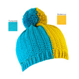 A half and half crochet bobble hat, split vertically in Turquoise and Buttercup Yellow by VelvetVolcano