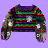 Black, purple, green and orange striped crochet jumper / sweater with spider web chest pocket and grey sleeves with bat, pumpkin, ghost, eyeball, spider and spider web applique designs. Cropped Spooky Season Sweater / Jumper by VelvetVolcano