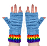 Dolphin blue crocheted fingerless gloves with rainbow striped cuffs by VelvetVolcano