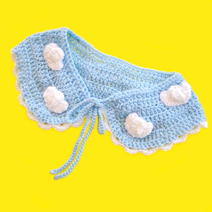 Light Blue crochet Peter Pan style collar with white cloud pattern and white scallop trim around the bottom edge. The collar fastens with braided light blue ties. - Cloud Collar by VelvetVolcano