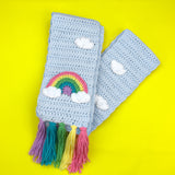 Light blue chunky crochet scarf with pastel rainbow and cloud design and pastel rainbow tassels by VelvetVolcano