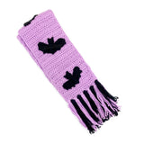 Lilac crocheted chunky scarf with black bat repeating applique pattern and lilac and black tassels by VelvetVolcano