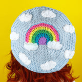 Cute Duck Egg Blue Crocheted Beret with White Clouds and Pastel Rainbow design by VelvetVolcano