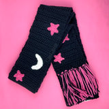 Chunky Celestial Scarf - Black crochet scarf with white crescent moon & bubblegum pink stars pattern with white, black and bubblegum pink tassels by VelvetVolcano