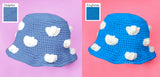 Two crochet bucket hats in different shades of blue with white cloud pattern by VelvetVolcano
