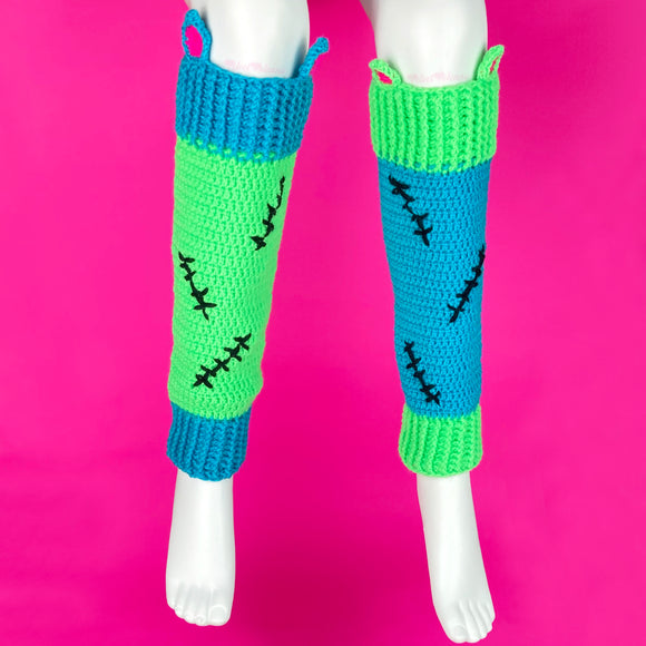 Frankenstein's Monster inspired Neon Green, Turquoise, Neon Pink and Black crochet leg warmers with contrasting design, cat ear and black stitch details. VelvetVolcano FrankenKitty Leg Warmers