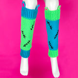 Frankenstein's Monster inspired Neon Green, Turquoise, Neon Pink and Black crochet leg warmers with contrasting design, cat ear and black stitch details. VelvetVolcano FrankenKitty Leg Warmers