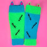 Frankenstein's Monster inspired Neon Green, Turquoise, Neon Pink and Black crochet leg warmers with contrasting design, cat ear and black stitch details. VelvetVolcano FrankenKitty Leg Warmers