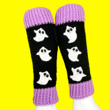 Black crochet leg warmers with a column of white ghosts with cute smiley faces and lilac ribbed cuffs. - VelvetVolcano Acrylic Crochet Spooky Ghost Leg Warmers