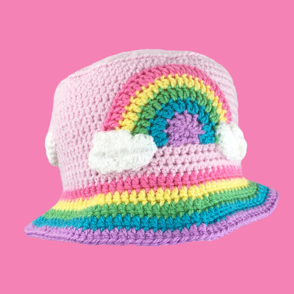 Super Kawaii Fairy Kei Baby Pink Crochet Bucket Hat with Pastel Rainbow Cloud Motif and Pastel Rainbow Striped Brim by VelvetVolcano