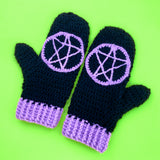 Black crochet hand warmers with lilac pentagram motifs and lilac cuffs. Witchy Mittens (Custom Colour) by VelvetVolcano