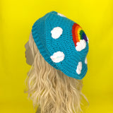 Bright Blue Crochet Beret Hat with Kawaii Rainbow Cloud Design by VelvetVolcano