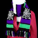 Purple, neon green, black and white striped crochet scarf with white cobweb panels and multicoloured tassels. Spider Web Stripe Scarf (Custom Colour) by VelvetVolcano