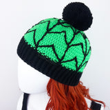 Neon Green crochet bobble hat with black cobweb design and black pom pom and bottom rib. Spider Web Pom Pom Beanie (Custom Colour) by VelvetVolcano