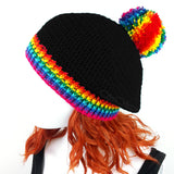 Black slouchy crochet bobble hat with rainbow pom pom and rainbow striped brim by VelvetVolcano