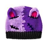 Half lilac, half violet crochet beanie with cat ears (which are hot pink inside) and a black ribbed brim, designed to look like a Frankenstein's Monster Kitty. Custom Colour FrankenKitty Beanie by VelvetVolcano