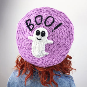 Lilac crochet beret with white smiley ghost applique and black BOO! lettering (BOO! Ghost Beret - Custom Colour Crochet Pastel Goth Hat by VelvetVolcano)