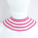 Bubblegum pink and white striped Peter Pan style detachable crochet collar with red and green cherry appliques on the lapels of the collar and a pink heart shaped button fastening. Cherry Stripe Collar by VelvetVolcano