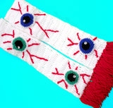 Eye See You Scarf - White Wraparound Crochet Scarf with Spooky Eyeball Pattern and Red Tassels by VelvetVolcano
