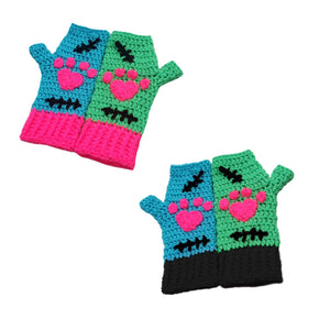 Turquoise and Neon Green Crochet Hand Warmers with either Neon Pink or Black Cuffs, Black embroidered stitch patterns and neon pink heart shaped paws. FrankenKitty Fingerless Gloves by VelvetVolcano