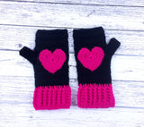 Black crochet hand warmers with hot pink heart design and hot pink cuffs. Heart Fingerless Gloves by VelvetVolcano