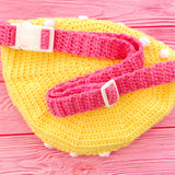 Yellow crochet bum bag with bubblegum pink strap, white polka dot print and a bubblegum pink square shaped front pocket with a yellow and white daisy by VelvetVolcano