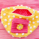 Yellow crochet bum bag with bubblegum pink strap, white polka dot print and a bubblegum pink square shaped front pocket with a yellow and white daisy by VelvetVolcano