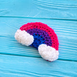 Bisexual Pride Flag inspired crochet hair clip, the bi pride flag colours are in the shape of a rainbow with white clouds at the ends. Hair clip by VelvetVolcano