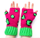 Neon pink crochet hand warmers with black and neon green leopard print design and neon green cuffs. Leopard Fingerless Gloves (Custom Colour) by VelvetVolcano