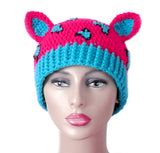 Hot Pink crochet cat ear hat with Turquoise inner ears and bottom rib and turquoise and black leopard print on the hot pink main part of the hat. Leopard Kitty Beanie (Custom Colour) by VelvetVolcano