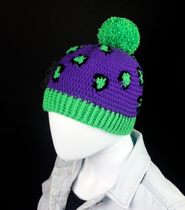 Violet crochet bobble hat with neon green pom pom, bottom rib and neon green and black leopard print pattern. Leopard Pom Pom Beanie by VelvetVolcano