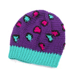 Purple crochet hat with pink, teal and black leopard print detail. Slouchy Leopard Beanie (Custom Colour) by VelvetVolcano