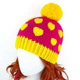 Cerise (Hot Pink) & Buttercup Yellow Heart Print Pom Pom Acrylic Crochet Beanie by VelvetVolcano