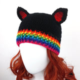 Black crochet cat ear beanie with rainbow ribbed section at the bottom of the hat and red inner ears. Bright Rainbow Rib Kitty Beanie (Custom Colour) by VelvetVolcano