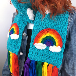 Turquoise chunky crochet scarf with rainbow tassels, rainbow & cloud motif and white cloud repeating pattern. Chunky Bright Rainbow Cloud Scarf by VelvetVolcano